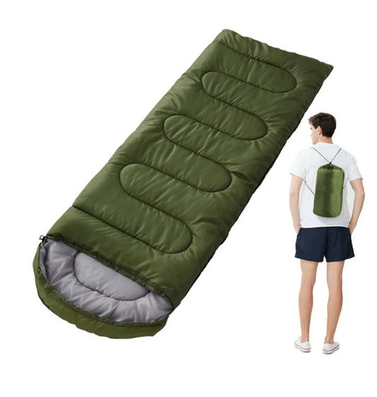 Green 1400g-1000g envelope-style sleeping bag features a waterproof polyester shell and includes a storage sack for easy transport.